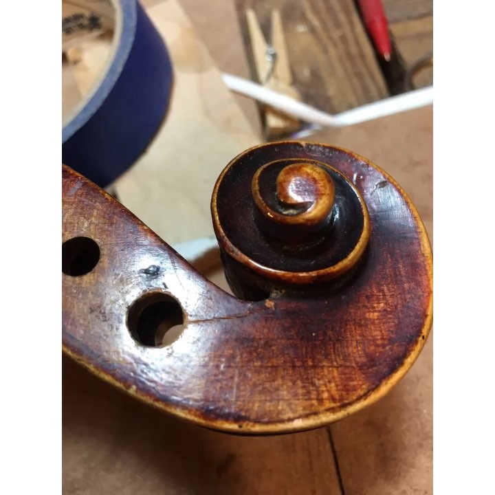 Scroll crack repair on the “A” tuning peg.  Shim, maple bushings, varnish touch up. Better than new